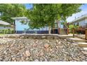 This lovely home boasts mature trees and a well-manicured yard, creating great curb appeal at 3306 S Logan St, Englewood, CO 80113