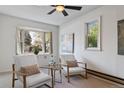 Cozy sunlit living room featuring neutral tones, and large bay window for natural light at 4550 Zephyr St, Wheat Ridge, CO 80033