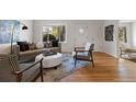 Stylish living room featuring hardwood floors, modern furniture, and bright natural light at 4550 Zephyr St, Wheat Ridge, CO 80033