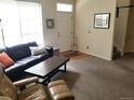 Comfortable living room with a modern sofa and ample natural light at 2240 S Pagosa Ct # B, Aurora, CO 80013
