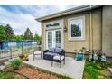 Charming patio area with outdoor seating, flowers, and a view of the well-maintained landscaping at 2479 S High St, Denver, CO 80210