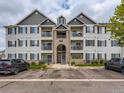 Three story apartment building featuring individual balconies and well maintained landscaping at 15700 E Jamison Dr # 7-203, Englewood, CO 80112