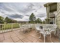 Relaxing patio area with ample seating, ideal for outdoor entertaining and enjoying scenic views at 3912 Ute Mountain Trl, Castle Rock, CO 80109