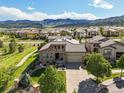 Beautiful aerial view of a well-maintained home in a neighborhood with mountain views at 2373 S Joyce St, Denver, CO 80228