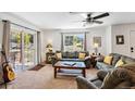 Comfortable living area with sofas, natural light, and access to outdoor patio at 283 Pelican Cir # 1703, Breckenridge, CO 80424