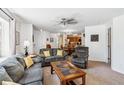Open-concept living area featuring comfortable sofas, a coffee table, and neutral tones at 283 Pelican Cir # 1703, Breckenridge, CO 80424