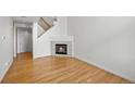 Cozy living room with hardwood floors and a modern fireplace at 584 Ridgeview Dr, Louisville, CO 80027