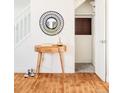 Inviting entryway with wood console table and a spacious coat closet at 6021 Yarrow St # B12, Arvada, CO 80004