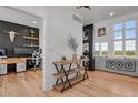 Transitional foyer showcasing a console table, seamlessly connecting the office and living room at 897 E Rim Rd, Franktown, CO 80116