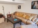 Cozy living room features a comfortable sectional couch and stylish decor at 2860 Ames St, Wheat Ridge, CO 80214