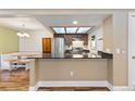 Charming eat-in kitchen with stainless steel appliances and breakfast nook at 10890 W Evans Ave # 1G, Lakewood, CO 80227
