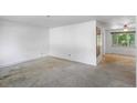 Empty living room with carpet, ready for personalized touches and furnishings at 892 S Union Blvd, Lakewood, CO 80228