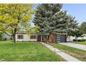 Charming single-story home with a well-maintained lawn and mature trees offering shade at 2865 S Cherry Way, Denver, CO 80222