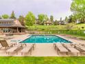 Resort style pool with ample lounge chairs and beautiful common areas at 23585 Genesee Village Rd # E, Golden, CO 80401