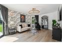 Cozy sitting room with patterned wallpaper and large window at 4736 S Fillmore Ct, Cherry Hills Village, CO 80113