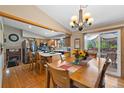 Open kitchen and dining area with island, stainless appliances, and access to the outdoor patio at 9700 W 88Th Pl, Westminster, CO 80021