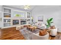 Comfortable living room with a fireplace and built-in shelving at 14712 Josephine St, Thornton, CO 80602