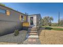 Charming home exterior featuring a brick foundation, and a well-kept yard at 5555 Julian St, Denver, CO 80221
