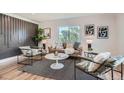 Modern living room features stylish furniture, contemporary decor, and large windows with scenic views at 5555 Julian St, Denver, CO 80221