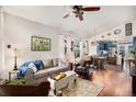 Comfortable living room with hardwood floors, plush seating, and views into the kitchen and dining area at 4318 Fossil Way, Castle Rock, CO 80109