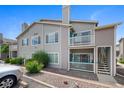 Exterior view of a condo showing its balconies, and a two-story design at 8437 Thunder Ridge Way # 202, Highlands Ranch, CO 80126