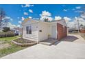 Charming single-story home with a combination of white siding and brick facade at 7819 Tejon St, Denver, CO 80221