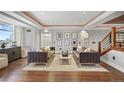 Open-concept living room featuring contemporary decor, hardwood floors, and modern lighting at 1891 Curtis St # 1812, Denver, CO 80202