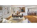 Comfortable living room with stylish decor, wood floors, bar seating and chic accents at 1891 Curtis St # 1812, Denver, CO 80202