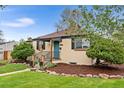 Charming home featuring rock landscaping, a manicured lawn, and inviting front entrance at 3000 N Fillmore St, Denver, CO 80205