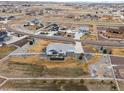 Sprawling suburban community featuring large lots, white fences, and mature landscaping at 11177 E 162Nd Pl, Brighton, CO 80602