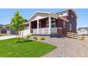 Well-maintained home with a covered porch, lovely landscaping, and inviting curb appeal at 1839 Morgan Dr, Erie, CO 80516