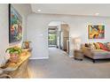 Living room featuring neutral colors, modern decor, and an open concept design at 1196 S Quebec Way, Denver, CO 80231