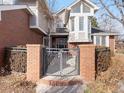 Front Entrance showing Brick facade and gated entry with walkway at 3 Winged Foot Way, Littleton, CO 80123