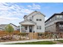 Inviting home with fenced yard and a charming front porch, perfect for relaxing outdoors at 2862 E 103Rd Ave, Denver, CO 80229