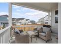 Relaxing outdoor porch with comfortable seating and neighborhood views, ideal for entertaining at 2862 E 103Rd Ave, Denver, CO 80229