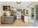 Well-equipped kitchen featuring stainless steel appliances, granite countertops, modern cabinetry, and hardwood floors at 31 Wild Tiger Ln, Boulder, CO 80302