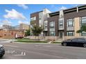 Modern townhome community with street view and landscaping at 1555 Perry St, Denver, CO 80204