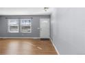 Living room with hardwood floors and neutral walls at 6730 Ingalls St, Arvada, CO 80003