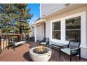 Relaxing back deck features firepit and seating area, perfect for outdoor entertaining at 8117 W 90Th Dr, Westminster, CO 80021