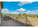 Outdoor deck with mountain views, comfortable seating, and stylish railings, perfect for relaxation and entertaining at 5385 W 51St Ave, Denver, CO 80212