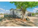 Inviting home with a charming front yard, updated exterior, and a spacious two-car garage at 5385 W 51St Ave, Denver, CO 80212