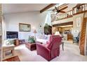 Inviting living room with vaulted ceilings and a skylight at 2685 S Dayton Way # 141, Denver, CO 80231