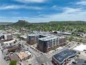 Gorgeous aerial view of the new condo buildings and surrounding city with blue skies at 20 Wilcox St # 517, Castle Rock, CO 80104