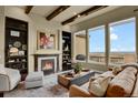 Spacious living room with fireplace and stunning views at 10510 Ladera Dr, Lone Tree, CO 80124