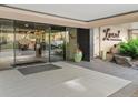 Building entryway showcasing glass doors, landscaping, and signage for the Lani at 800 Westside at 800 N Washington St # 1010, Denver, CO 80203