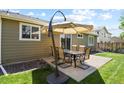 Cozy backyard patio with an outdoor dining set, perfect for entertaining and relaxation at 20709 E Hampden Pl, Aurora, CO 80013