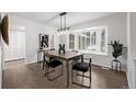 Inviting dining room featuring a bay window, natural light, and stylish decor for an elegant space at 1661 Red Fox Pl, Highlands Ranch, CO 80126