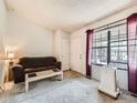 Bright living room featuring a large window and comfortable seating area at 8236 Washington St # 29, Denver, CO 80229