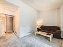 Cozy living room space with neutral carpet, perfect for relaxation and entertaining at 8236 Washington St # 29, Denver, CO 80229