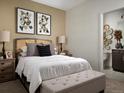 Inviting bedroom with stylish decor, a comfortable bed, and an ensuite bathroom, perfect for relaxation at 24005 E Utah Pl, Aurora, CO 80018
